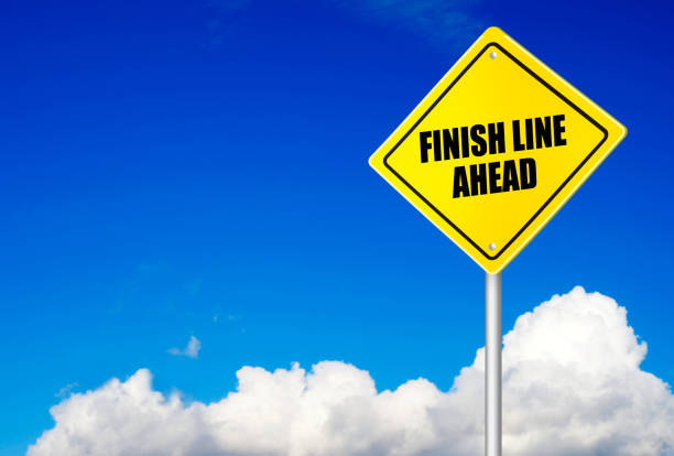 istock Finish line ahead message on road sign 536134981