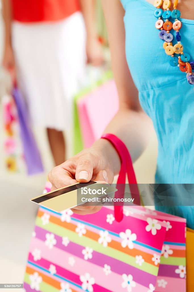 Before payment Image of womans hand giving plastic card in the mall Bag Stock Photo