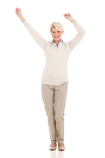 istock middle aged woman dancing 536136163