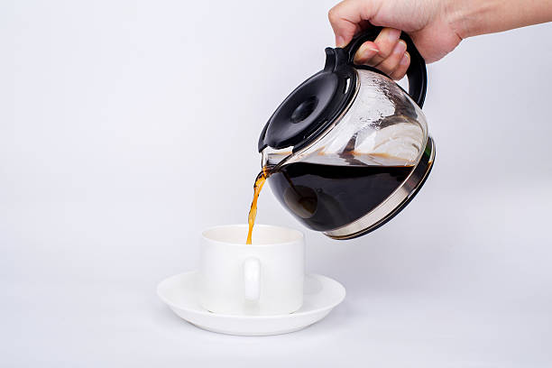 istock pouring coffee to a coffee cup 536136695