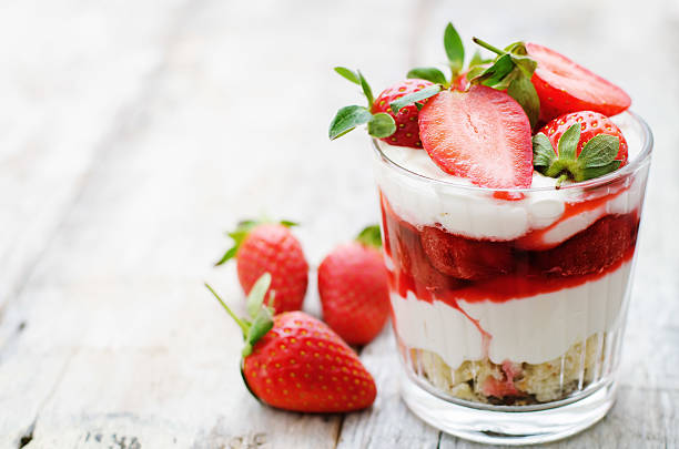 istock layered dessert with strawberries, biscuit cake and cream cheese 536137479