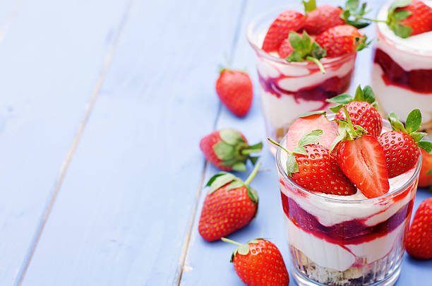 istock layered dessert with strawberries, biscuit cake and cream cheese 536137489