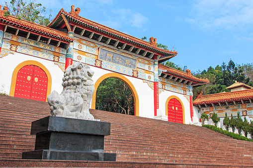 Kaohsiung, Taiwan - December 15, 2014: Entrance of the Fo Guang Shan Hsi Lai Temple of Kaohsiung. Statue of a Lion on the foreground