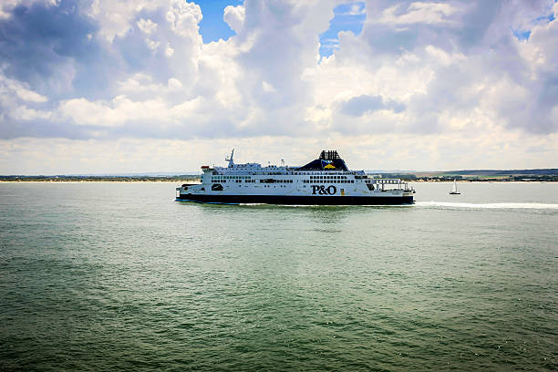 Cross-Channel Ferryboat leaving Calais France Port of Calais, France, EU - July 20, 2012: P&O Cross-channel ferry leaving the port of Calais on it's trip to Dover in England. ferry dover england calais france uk stock pictures, royalty-free photos & images