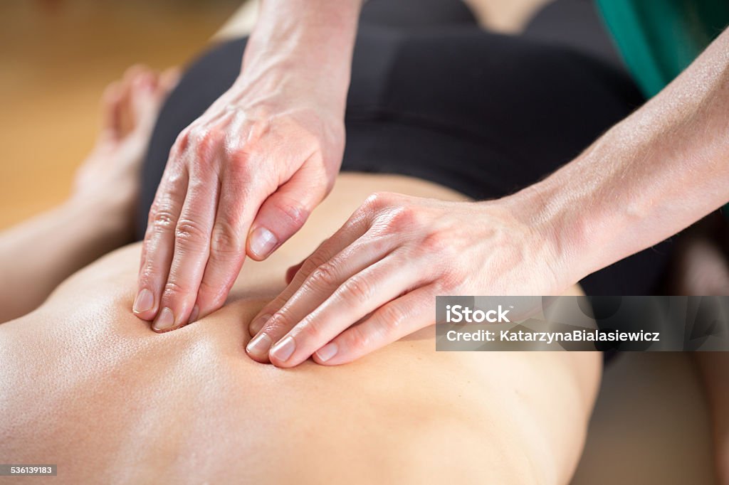 Close-up of hands Close-up of masseur's hands doing the spine massage Massaging Stock Photo