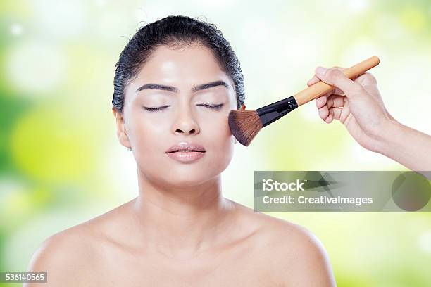 Woman Apply Makeup While Closing Eyes Stock Photo - Download Image Now - 2015, Adult, Adults Only