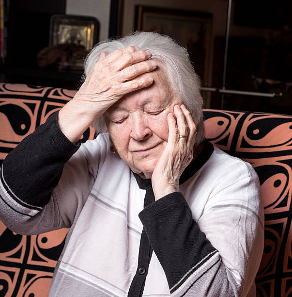 istock Old woman suffering from headache 536141865