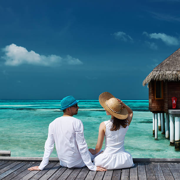 istock Couple on a beach jetty at Maldives 536168743