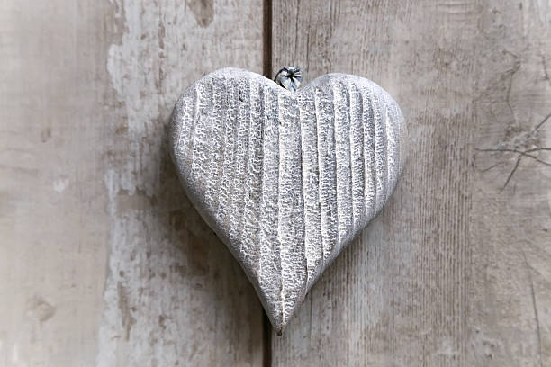 istock heart on old wood background 536173055