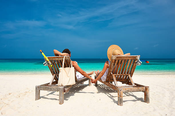 istock Couple in white relax on a beach at Maldives 536189347