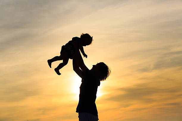 istock Father and little daughter at sunset 536191857