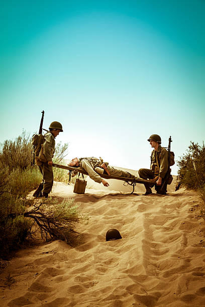 istock WWII Medics With Stretcher Rush To Save A Fallen Soldier 536193059