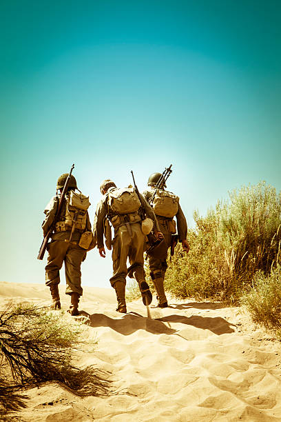 istock WWII Soldiers Climbing A Hill Together 536193061