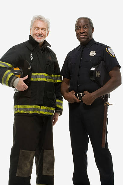 Portrait of a firefighter and a police officer Portrait of a firefighter and a police officer police and firemen stock pictures, royalty-free photos & images