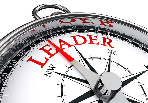 leader red word on concept compass stock photo