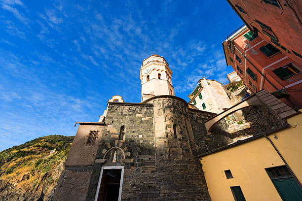 Vernazza village with belfry and apse of church of Santa Margherita di Antiochia, cinque terre national park in Liguria Italy. UNESCO world heritage site