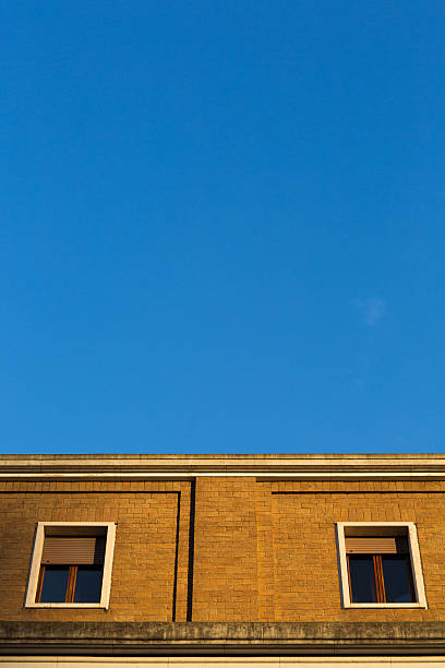 istock Windows on yellow dwelling house 536194769