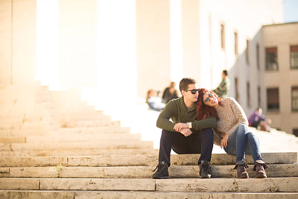 istock Couple sitting on the steps in front of the Faculty 536194779