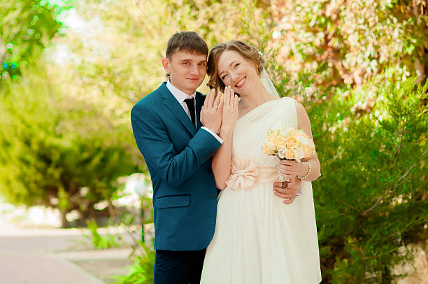 istock The bride and groom in summer park 536194955