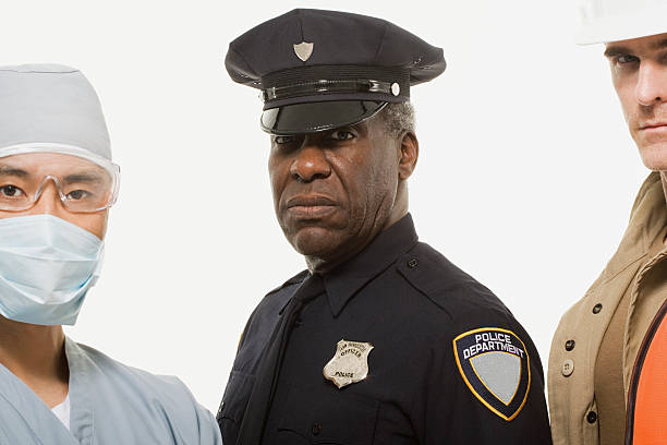 Portrait of a surgeon a police officer  a construction worker Portrait of a surgeon a police officer and a construction worker macho photos stock pictures, royalty-free photos & images