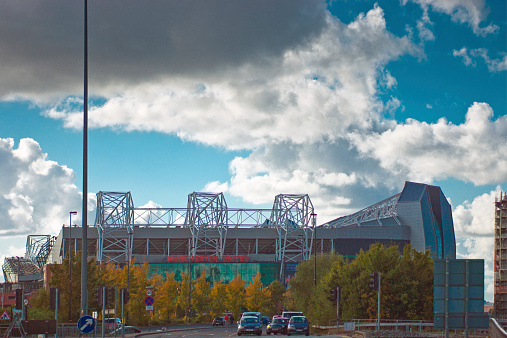 Manchester, United Kingdom - October 4, 2014: Dark clouds over Manchester United football stadium, Old Trafford.