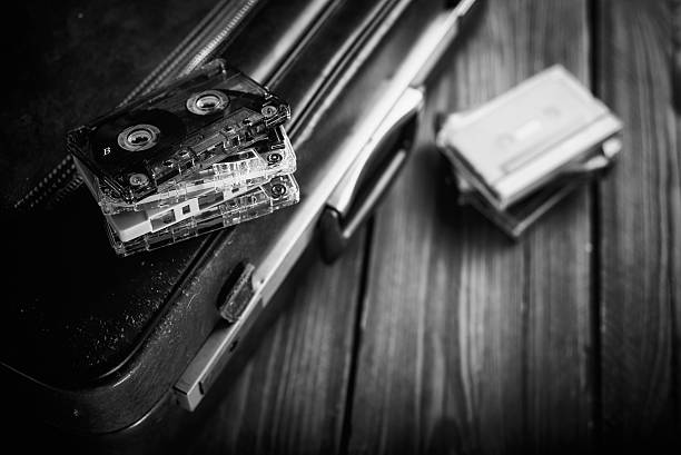 Cassette tape lying on an old suitcase. Vintage Retouching stock photo