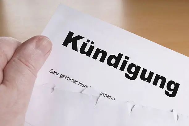 Kuendigung hand holding german termination letter 