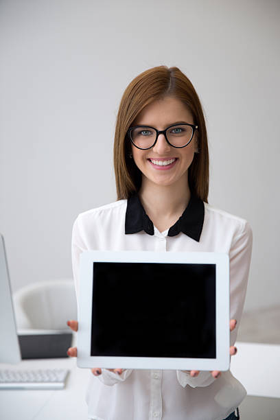 istock businesswoman showing tablet computer screen 536218165