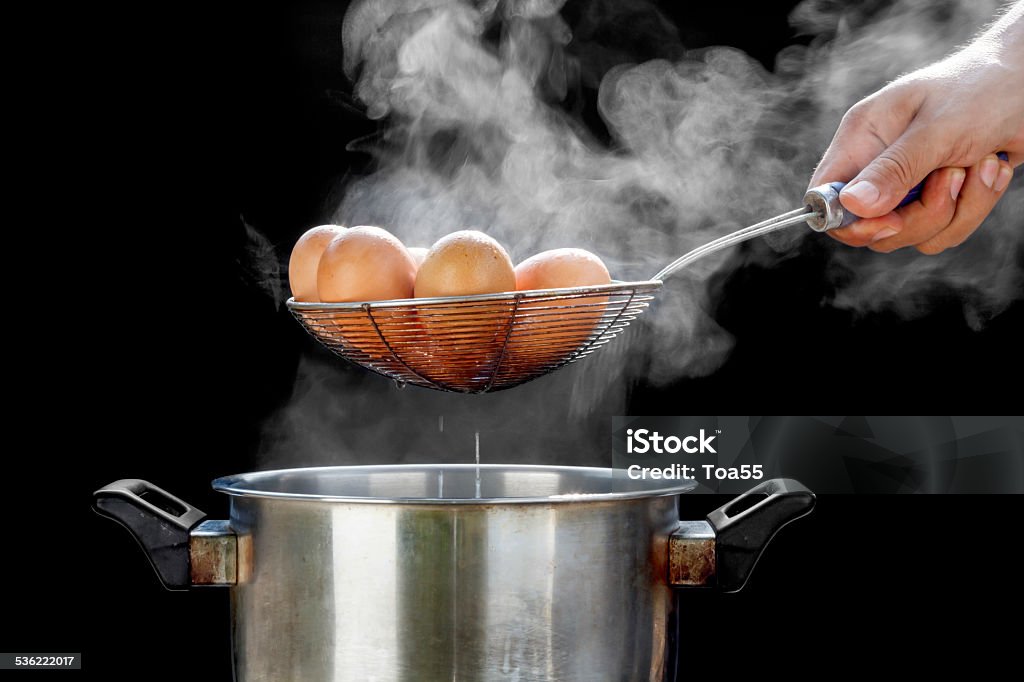 boiling eggs in stainless steel pot 2015 Stock Photo