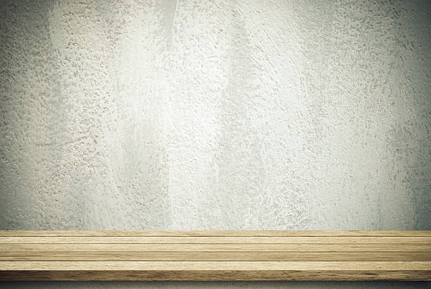 istock Empty wooden table over grunge cement wall. 536222621