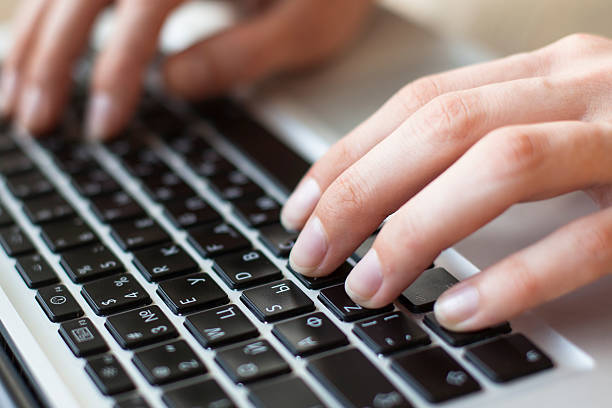 istock Female fingers on the keyboard close-up. 536245525