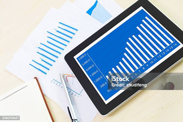 Table With Tabletchartand Office Supplies Stock Photo - Download Image Now - 2015, Business, Cash Flow