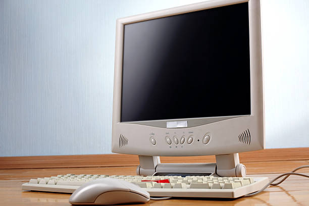 istock classic work place - keyboard and monitor at table 536247189