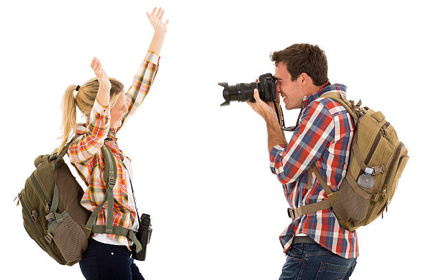 istock young man photographing his girlfriend 536247829