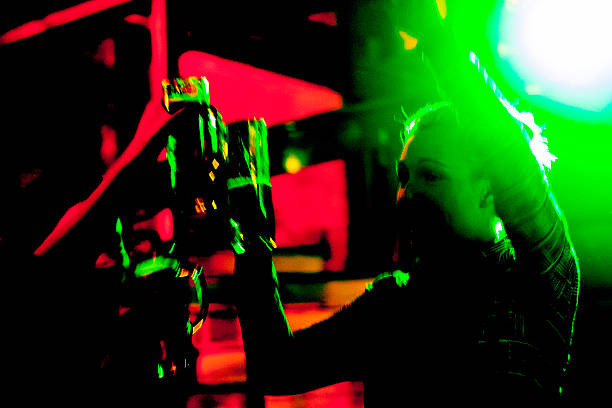 istock toast: young people drinking beer in nightclub 536248923