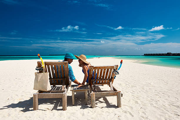 istock Couple relax on a beach at Maldives 536250627