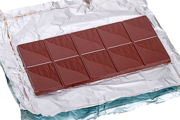 istock Bar of chocolate on a foil 536272095