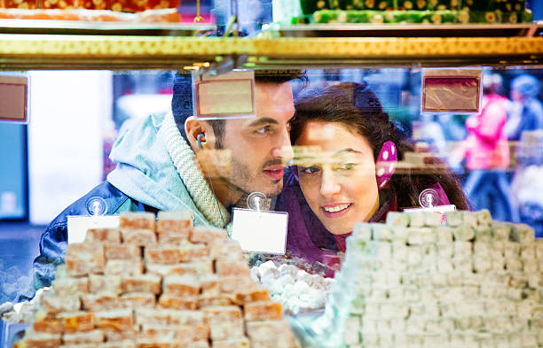istock Young Turkish couple window shopping for loukoum 536272963