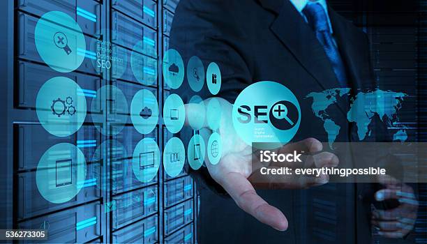 Double Exposure Of Businessman Hand Showing Search Engine Optimization Stock Photo - Download Image Now