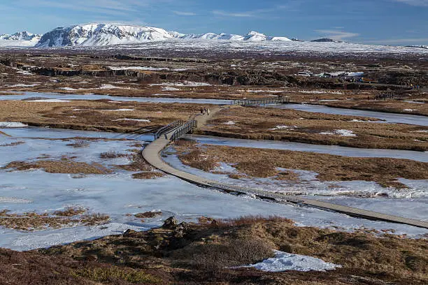 Photo of Scenic view of walkway across frozen Thingvellir National Park, Iceland