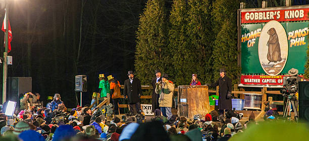 Gobbler's Knob - Punxsutawney, PA Punxsutawney, PA, USA - February 2, 2010: Visitors enjoy the festivities on stage prior to the main event on the early morning of Groundhog Day 2010. groundhog day stock pictures, royalty-free photos & images