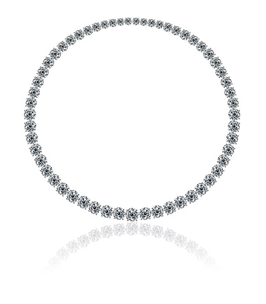 A necklace with white round diamonds on a white background with reflection