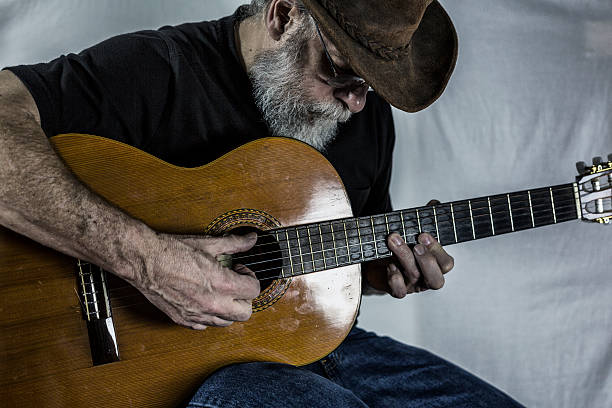 istock Senior Man Playing Acoustic Folk Guitar 536287543