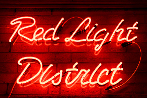 A red neon sign in the Red Light District of Amsterdam, The Netherlands