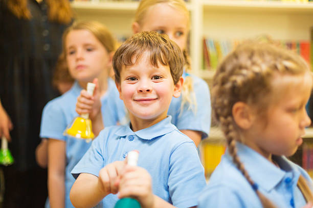 istock School Boy Making Music With a Bell 536288203