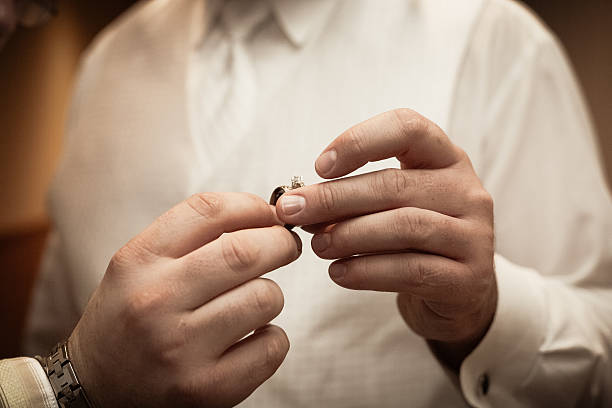 istock Best man handing wedding ring to groom 536288277