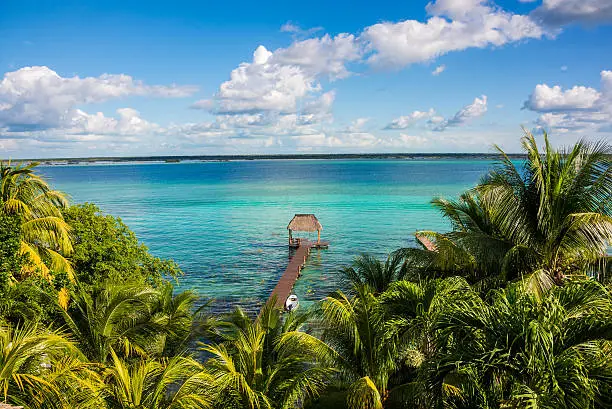 Perfect view of caribbean lagoon Bacalar. Seven Color water. Pier and Hut. Tropical Jungle, Central America Adventure.