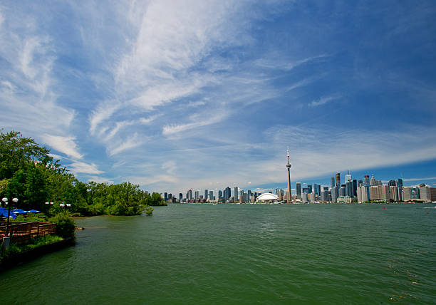 The Rogers Centre Baseball stadium, the CN Tower Toronto skyscraper high building, and the skyline. Ontario Lake, Ontario, Canada