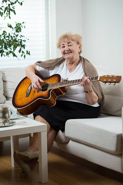 istock Elderly woman playing the guitar 536292879