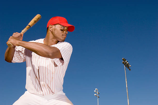 Baseball Batter Preparing to Hit Ball Baseball Batter Preparing to Hit Ball baseball player at bat stock pictures, royalty-free photos & images